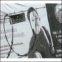 photo of woman behind barbed wire