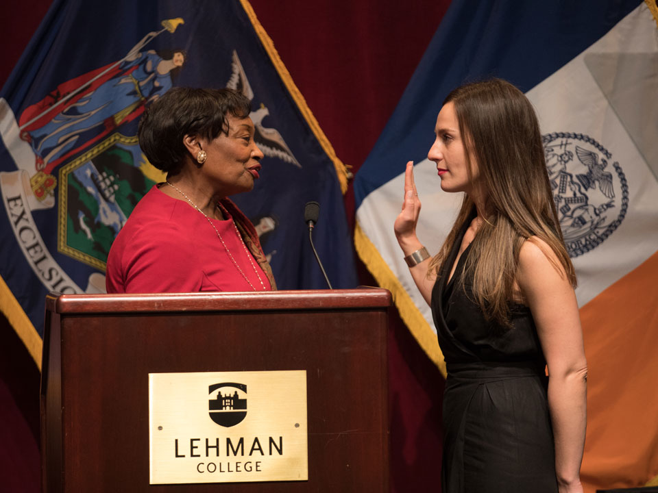 Photo of NY State Senator Alessandra Biaggi being sworn in at Lehman College by State senator and  majority conference leader Andrea Stewart-Cousins