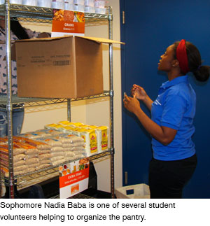Sophomore Nadia Baba is one of several student volunteers helping to organize the pantry.