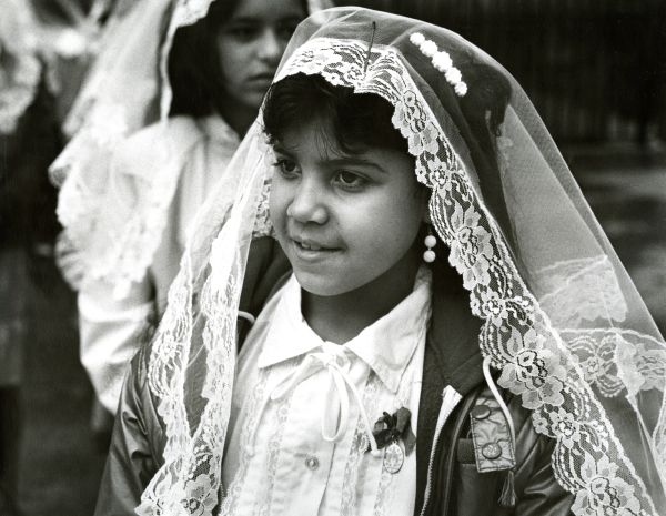 Image of a girl in a good Friday parade.