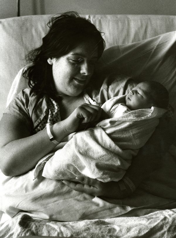 Image of a mother cradling her baby.