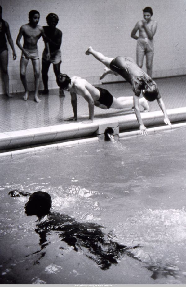 Image of students swimming and diving into in a pool