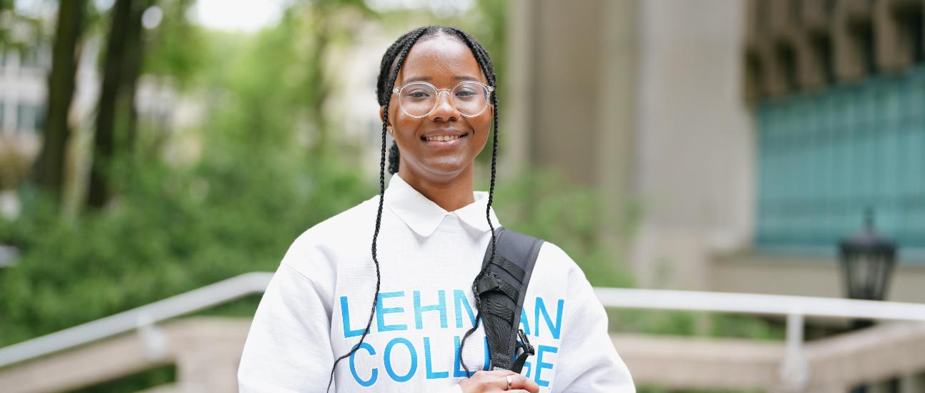 Lehman Student with backpack on campus