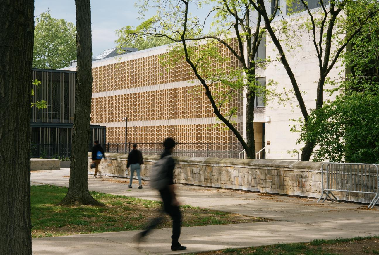 Student Walking Across Campus