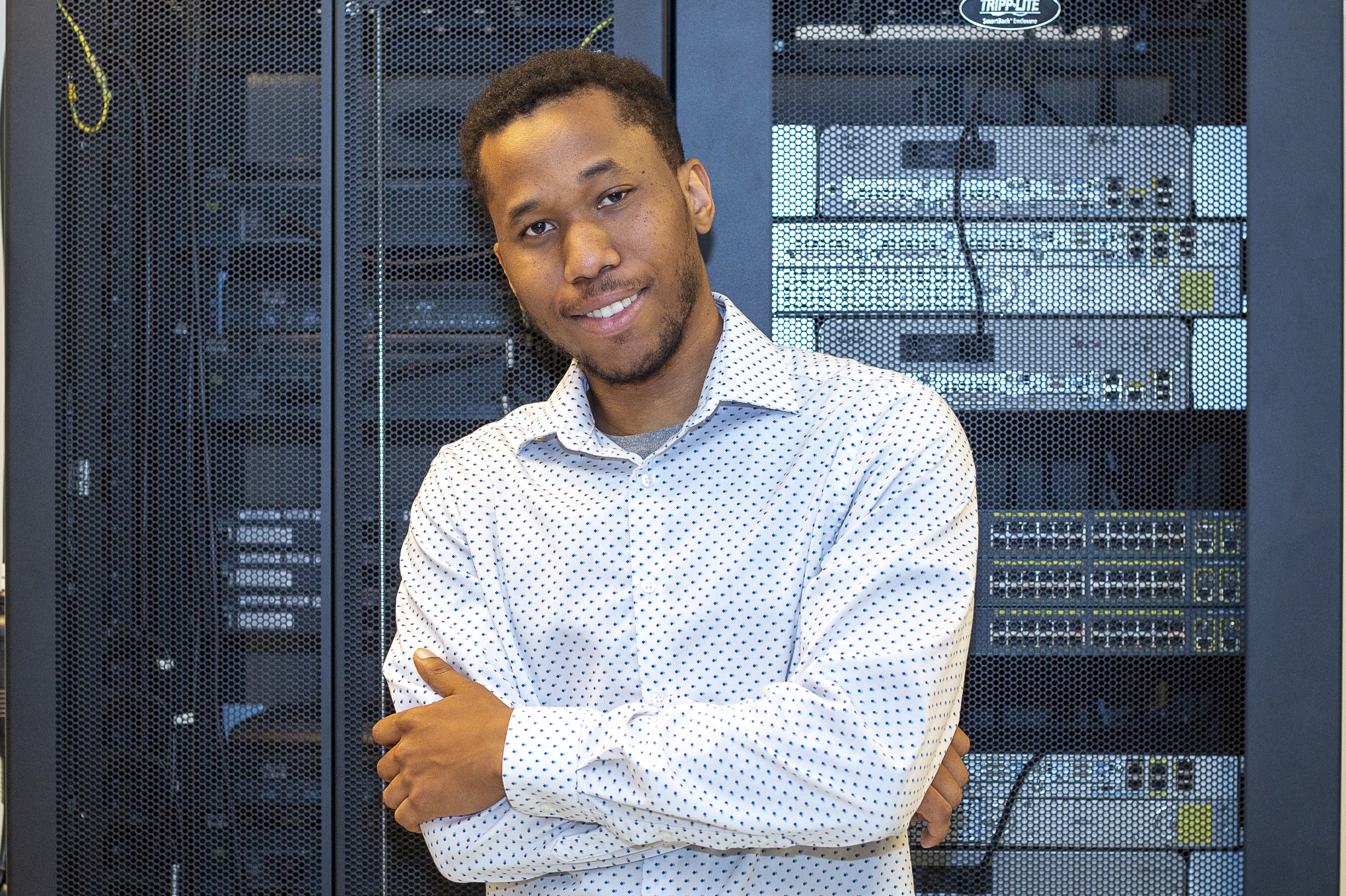 instructor in front of IT equipment