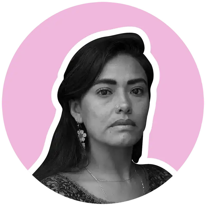 Cinthya-Santos-Briones headshot on pink background