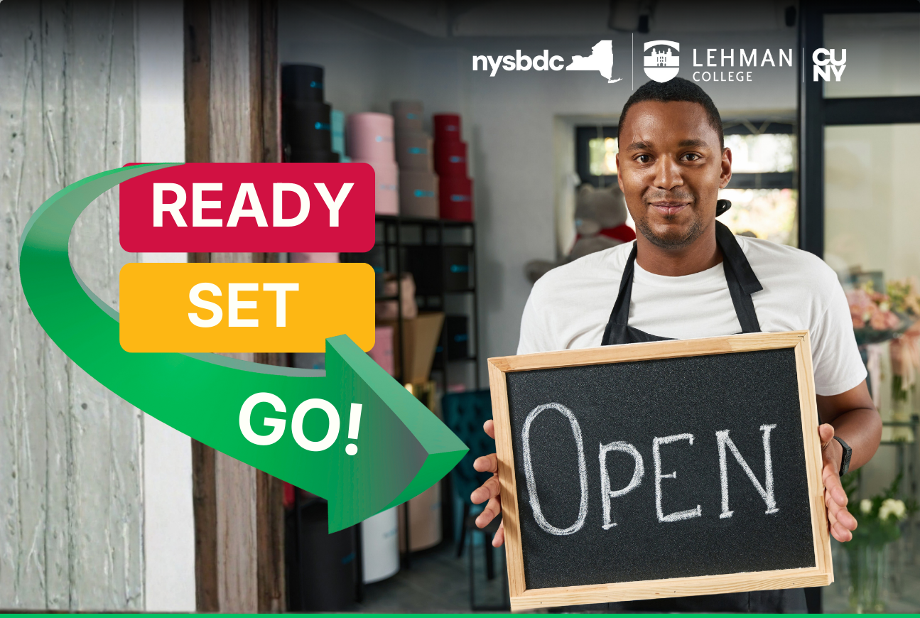 man holding an open sign for his business