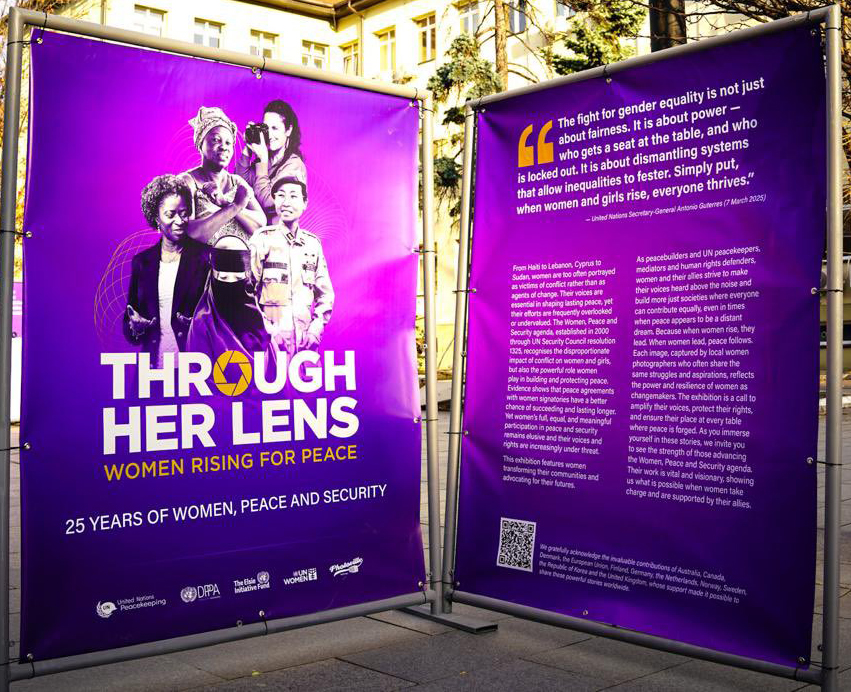 Through Her Lens Exhibit picture of women and text about the exhibit