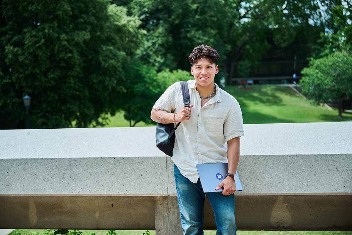 Graduate student in front of the quad at Lehman College graduate school