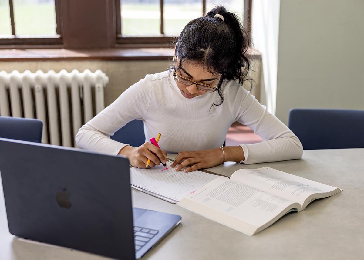 Photo of student writing in notebook