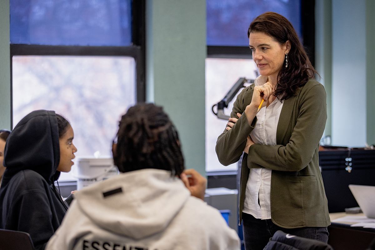 Photo of students in classroom with professor
