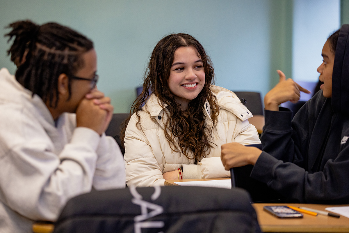 Photo of students talking while in classroom