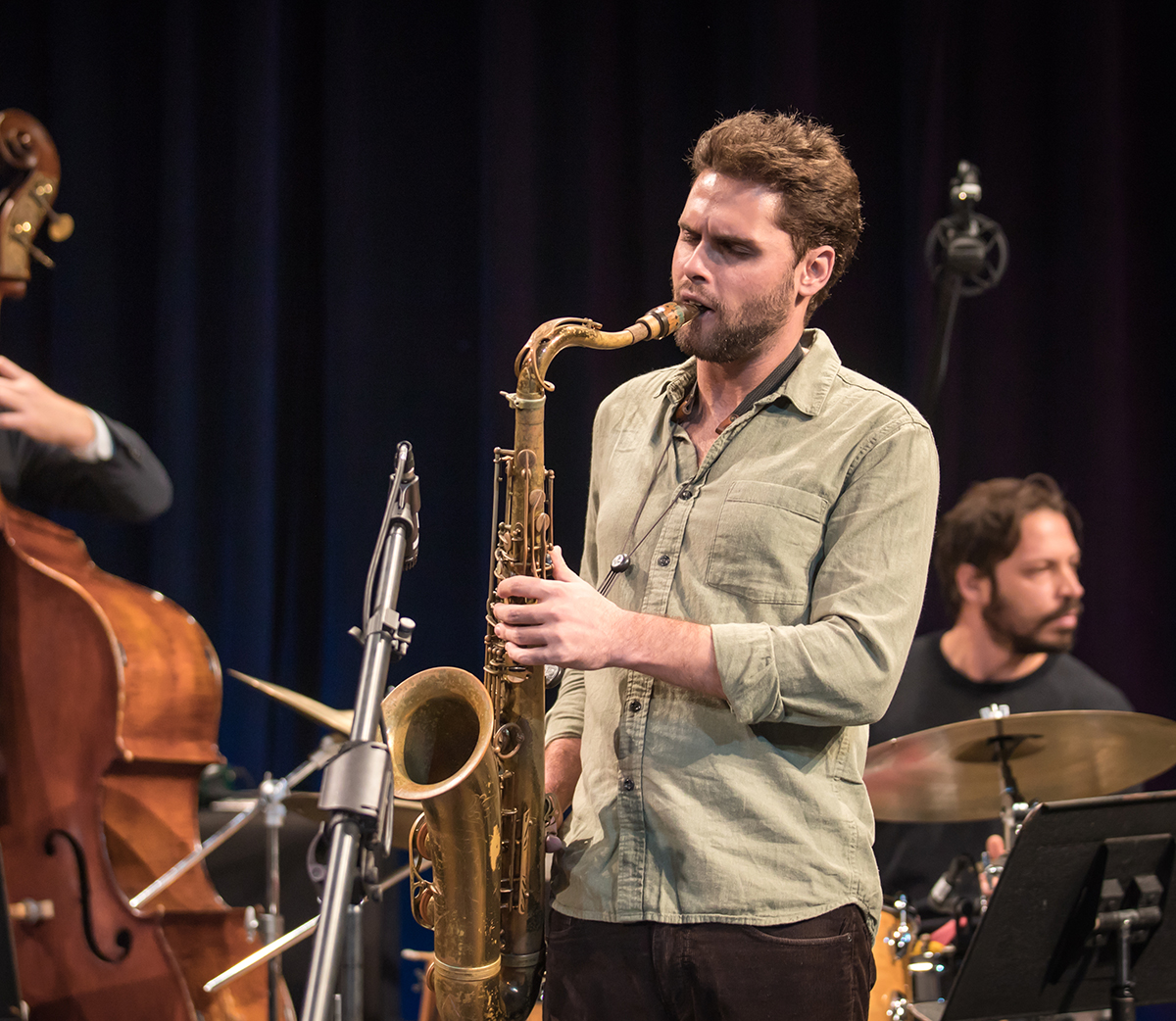 A jazz performance live with saxophone, double bass, and drums, during 2018 Jazz Festival.
