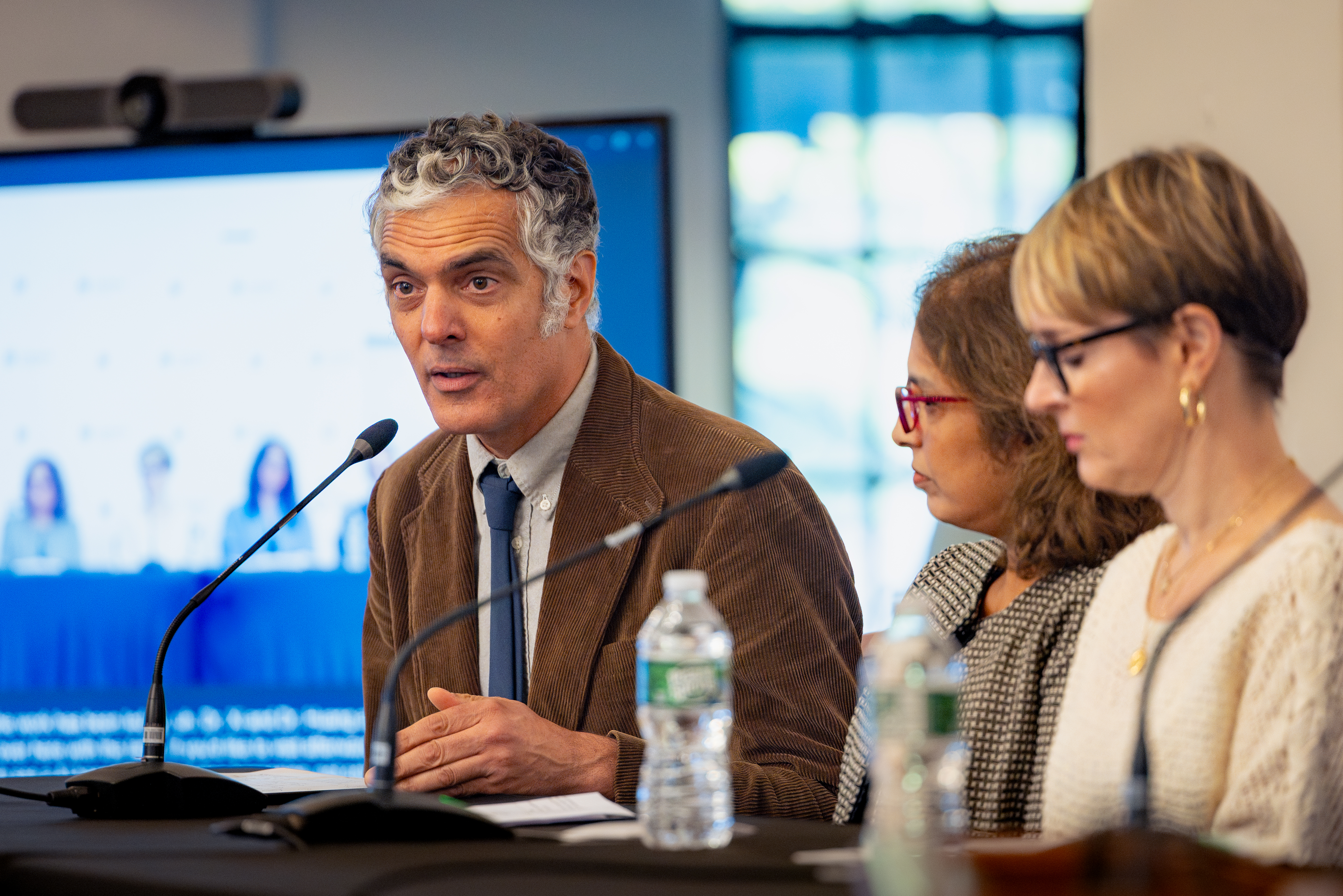 Stephen Redenti, Ivelyse Andino, and Alison Connelly-Flores in a panel discussion at the symposium.