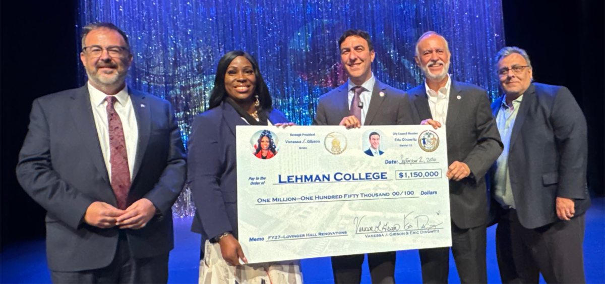 Dinowitz and Gibson hold giant check for Lovinger Theatre along with Lehman and CUNY