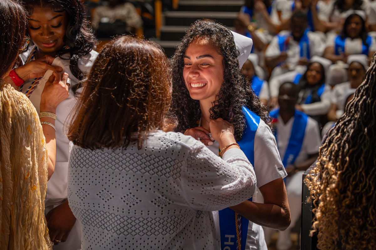 A graduate is pinned at the 2026 nursing pinning ceremony