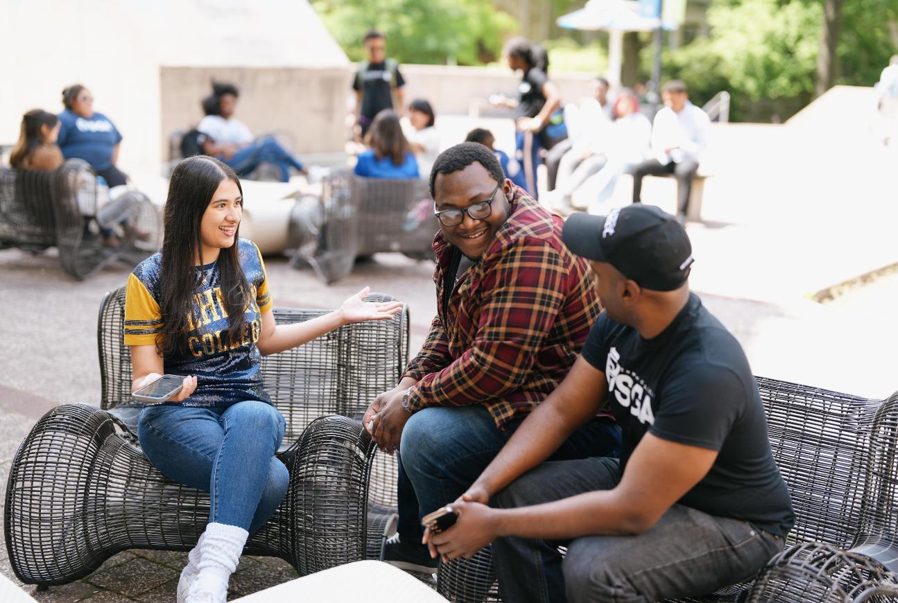 Lehman Students together on a bench