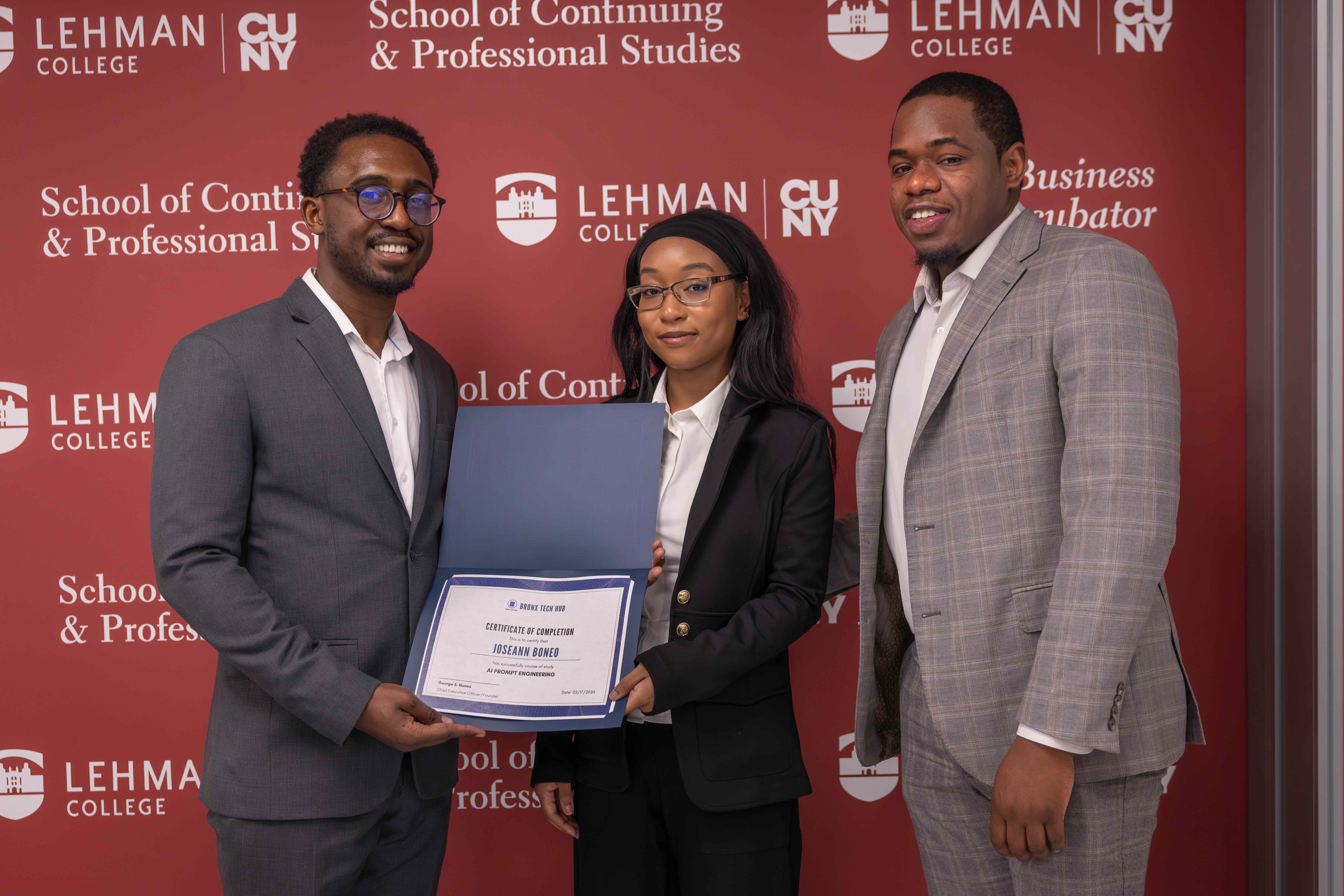 A Bronx Tech Hub fellow displays her certificate at the program showcase.