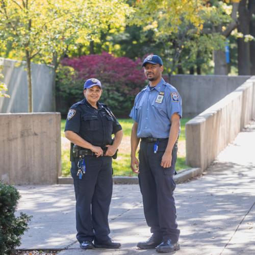 Two Public Safety Officers smiling