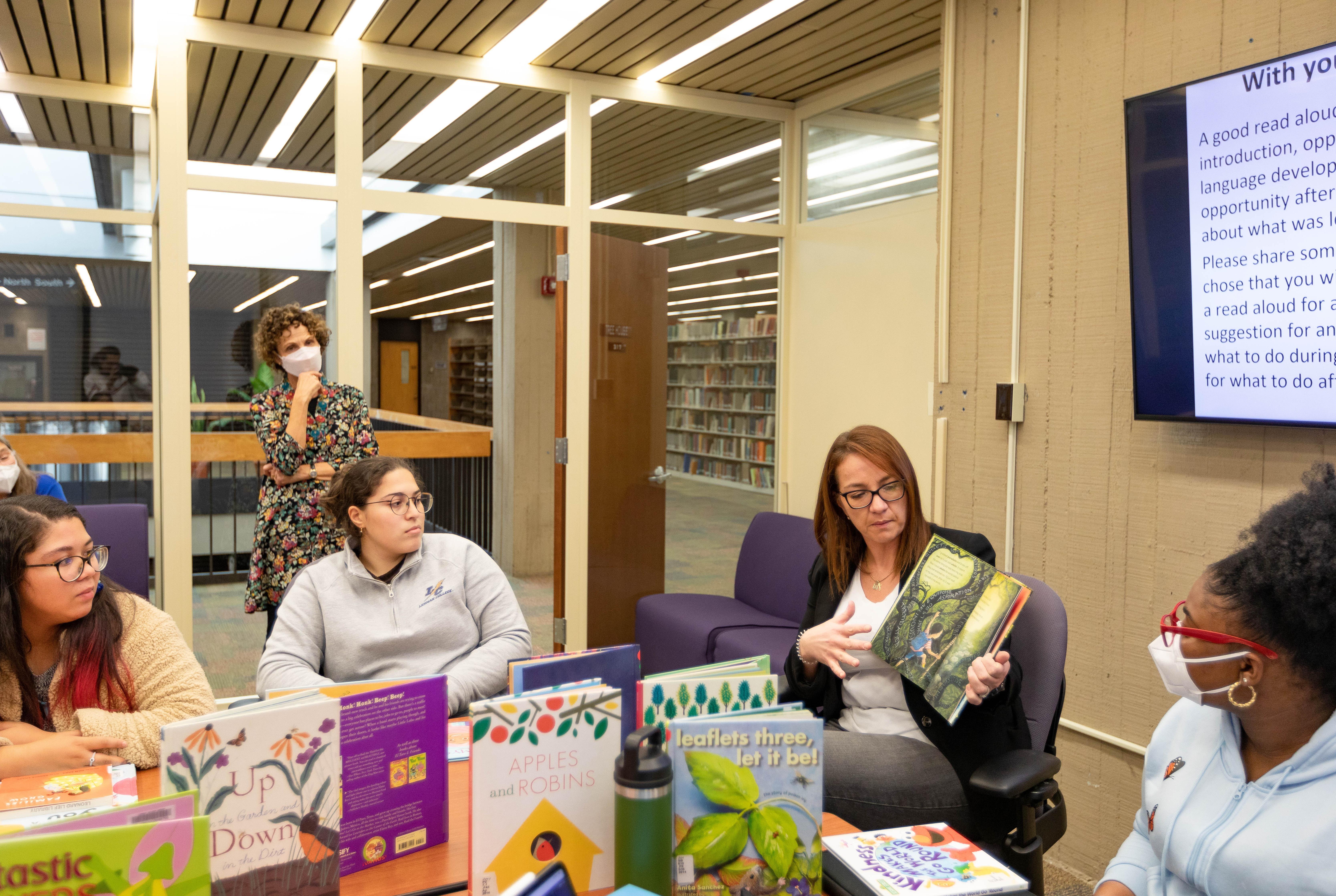 Teachers with children's books