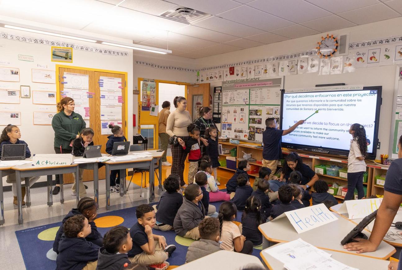 Teacher teaching children for LUTE Multi