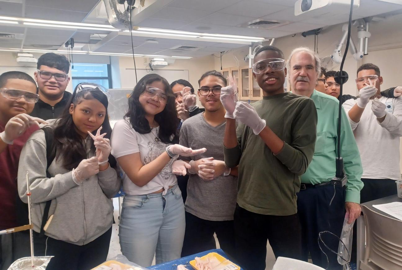 Group picture of high school students and instructor in lab