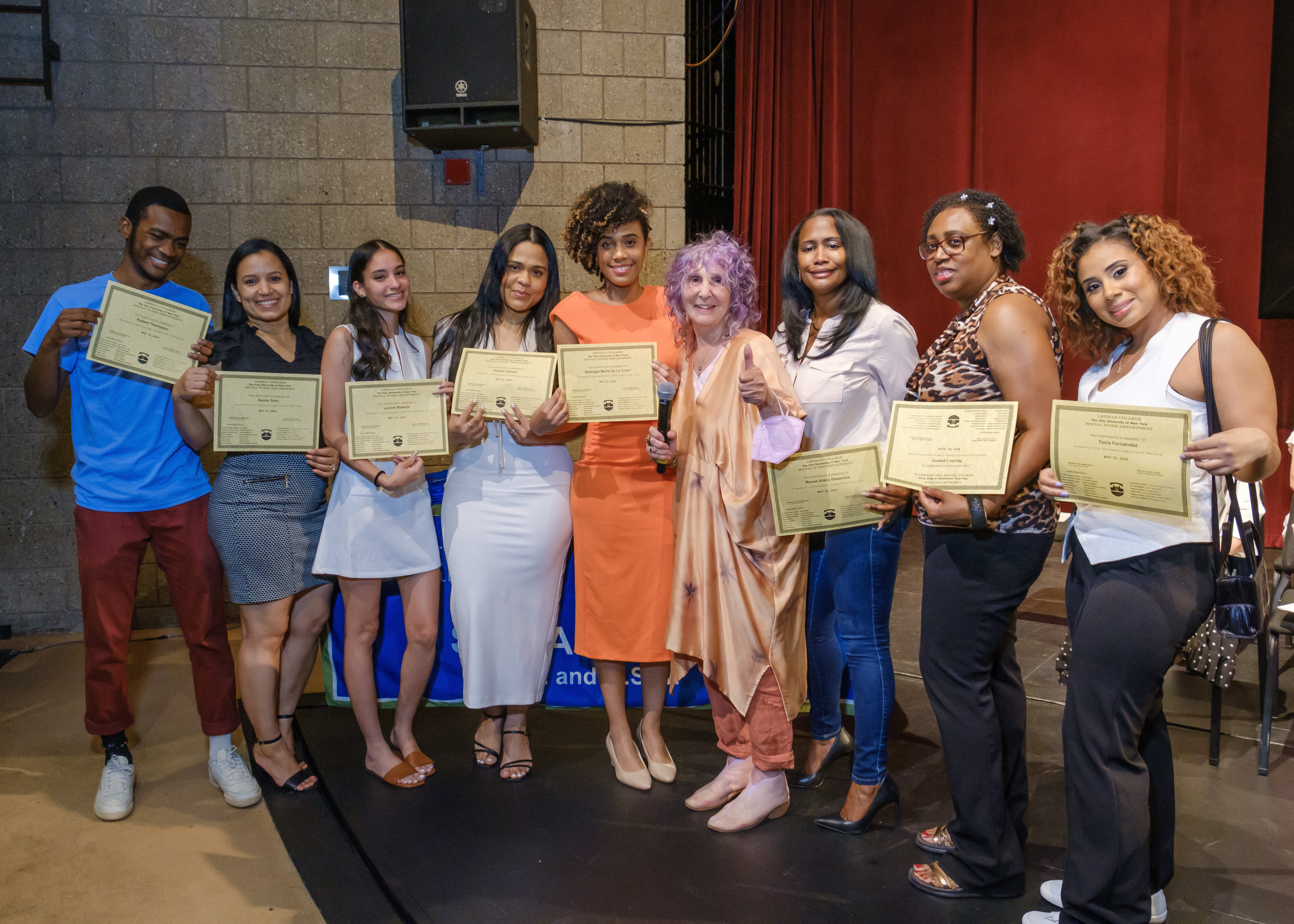 A group of Social Work Graduates posing with Professor Lori Spector