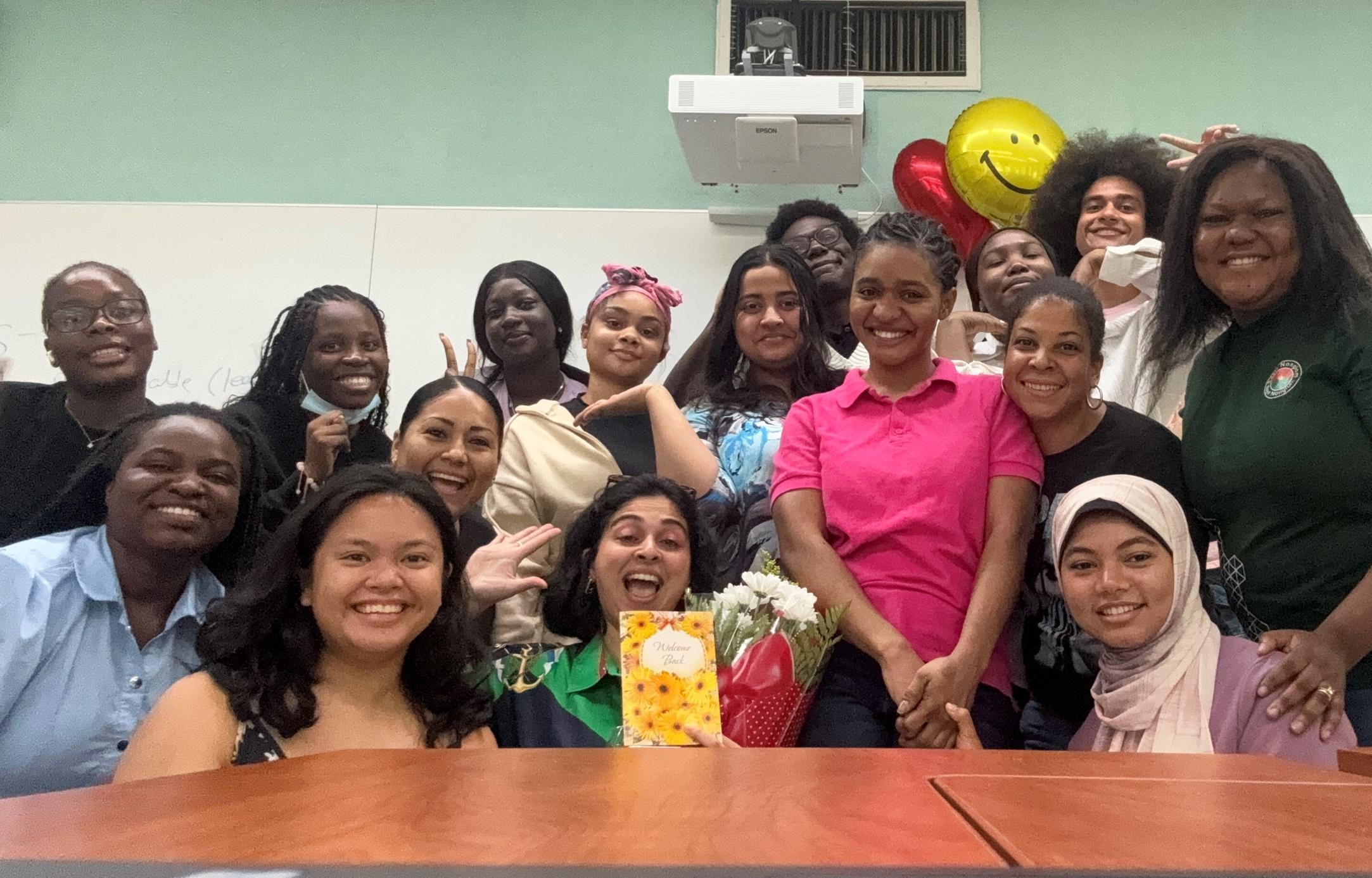 A group of students posing after their summer workshop with the workshop facilitator