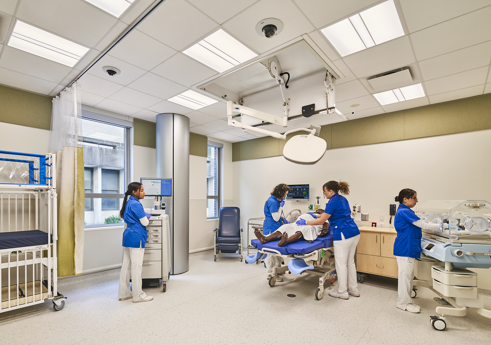 Nurses working with a practice dummy