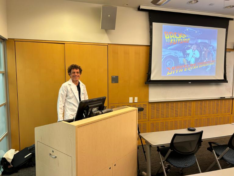 Image of a talk on time travel and extra dimensions.